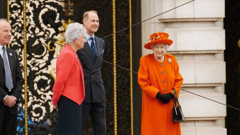 LONDON, circa 2021 - Queen Elizabeth II with Prince Edward launch the Queen's Baton relay from Buckingham Palace, London, England, UK, ahead of the 2022 Commonwealth games in Birmingham