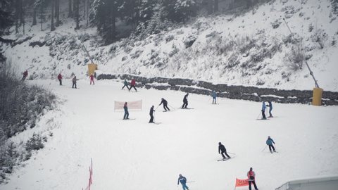 Bansko, Bulgaria - 15 Jan, 2021: People skiing, snowboarding in the ski resort Bansko, Bulgaria