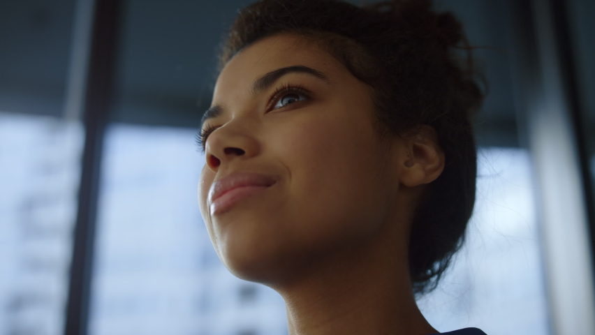 Dreamy woman face closeup. Portrait smiling businesswoman drinking coffee in office. Black business consultant enjoying coffee at  work break. Top manager corporate employee relax rest in office | Shutterstock HD Video #1080418748