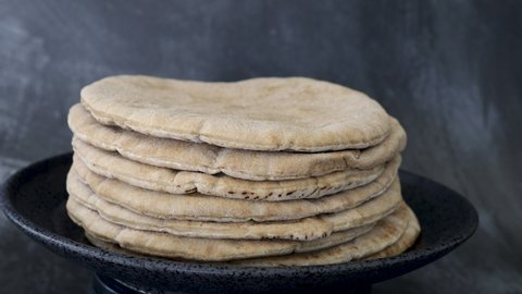 A Rotating Stack of Pita Bread