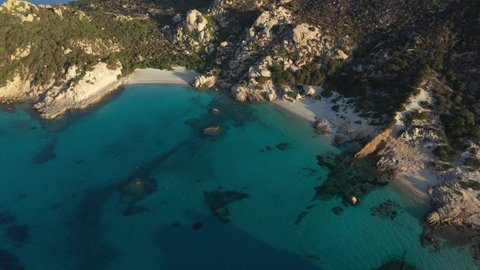 View from above, stunning aerial view of Spargi Island with Cala Corsara, a white sand beach bathed by a turquoise water. La Maddalena archipelago National Park, Sardinia, Italy.	