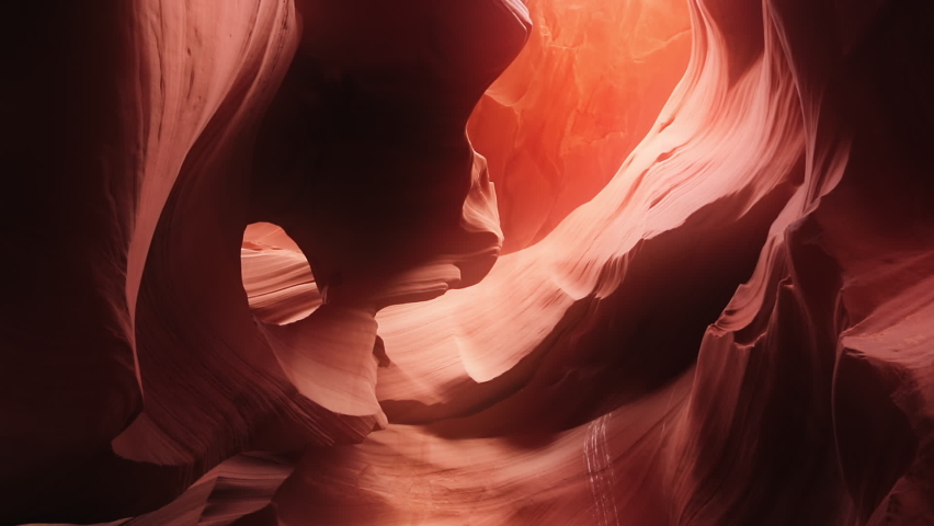 Cinematic footage red wavy pattern nature background from world famous landmark Antelope canyon in Arizona nature park, USA travel concept. Beautiful smooth wavy texture orange sandstone walls Royalty-Free Stock Footage #1080426458