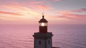 The Cabo da Roca Lighthouse, Sintra, Portugal, Europe. Calm and magical sunset at the picturesque cape. Aerial footage of breathtaking natural scenery with operating beacon. High quality 4k footage - Powered by Shutterstock - Get 15% off with code: PIKWIZARD15