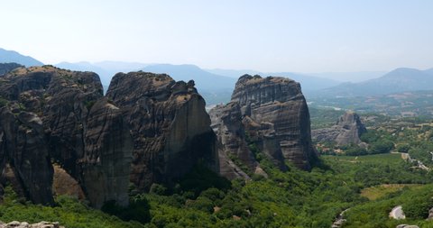 Meteora monasteries. Beautiful view of the Monastery of the Holy Trinity placed on the edge of a high rock covered Kastraki, mainland Greece