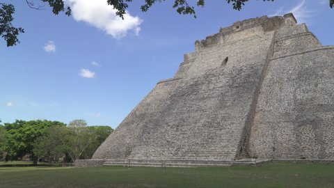 UXMAL, YUCATAN, MEXICO - MAY 2021: Ruins of the Pyramid of the Magician, an ancient Mayan temple and the central landmark of Uxmal