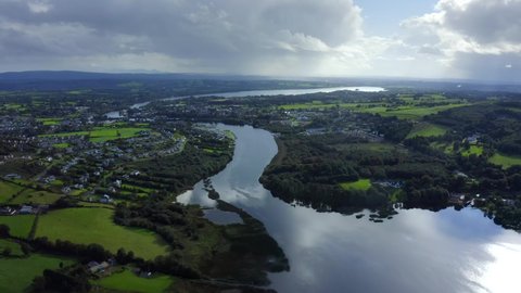 Killaloe, County Clare, Ireland, September 2021. Drone gradually ascends while pulling backwards from the town while looking south from Carrowgar Bay.