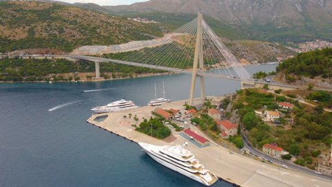 Dubnovnik , Croatia - 08 05 2021: Aerial View Of Luxury Cruise Ship And Superyacht Near Franjo Tudman Bridge In Dubrovnik, Croatia. - pullback