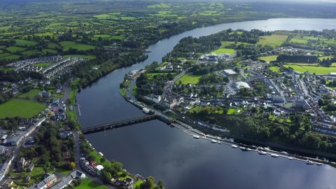 Killaloe, County Clare, Ireland, September 2021. Drone gradually descends towards the town while looking south towards Saint Flannan's Cathedral.