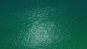 Aerial view video of disturbed blue ocean water surface. 4K  