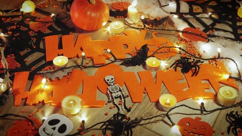 Happy halloween. Horror house. Halloween decorations candles spiders with cobweb, skeleton and bats. Celebrating Halloween. Trick or treat. Pumpkin scary faces