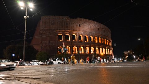 Time lapse of the Colosseum in Rome, in the evening with street level view