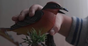 Toy plastic singing bird video close-up