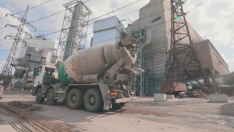 The concrete mixer at the plant. the concrete mixer at the industrial plant. The concrete mixer drives around the plant