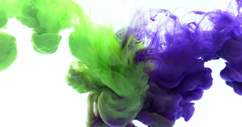 Purple and green color paints ink drops in water in blue background, slow motion of beautiful paint abstract falling. 4K.