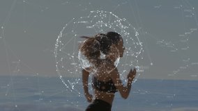 Animation of networks of connections with globe over caucasian woman running on beach. global sports, fintess and healthy lifestyle concept digitally generated video.