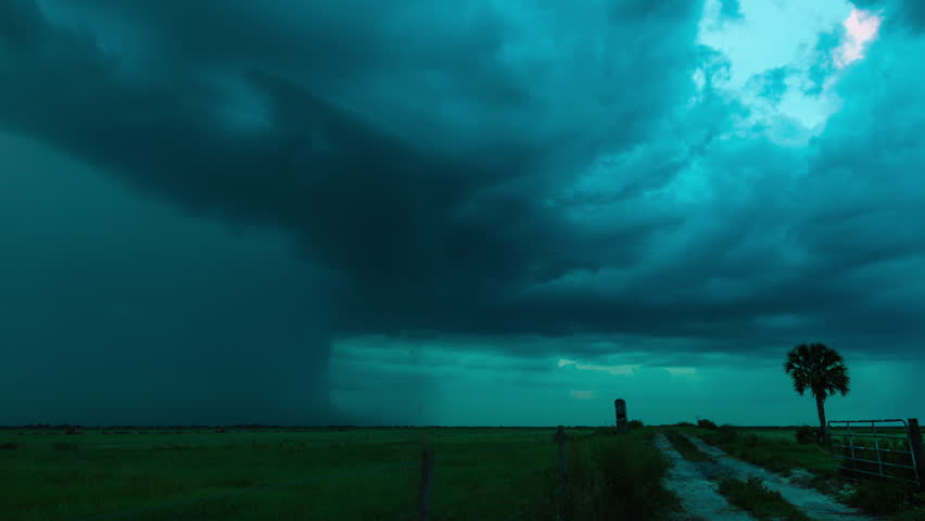 Time-lapse of severe pulse thunderstorm with intense lightning over the southern Florida wetlands at dusk.