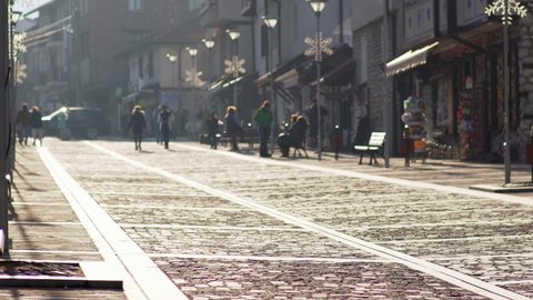 Bansko, Bulgaria - 20 Feb, 2020: People walk the old town pavement street