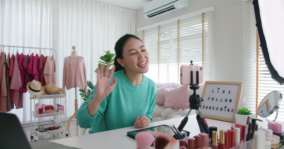 Asia woman micro influencer record live viral video camera at home studio. Happy youtuber fun talk speak advice review hobby in media. Vlog selfie shoot enjoy work show smile teach like share app. | Shutterstock HD Video #1080520097