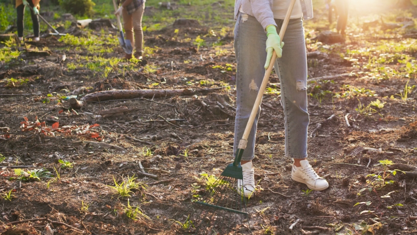 ECOl voluntary organization conserving environment to save our planet. Female eco activist holding a shovel and looking at camera. Environmental conservation concept