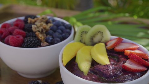 Acai bowl with various fruit and ingredients. Shot on RED.