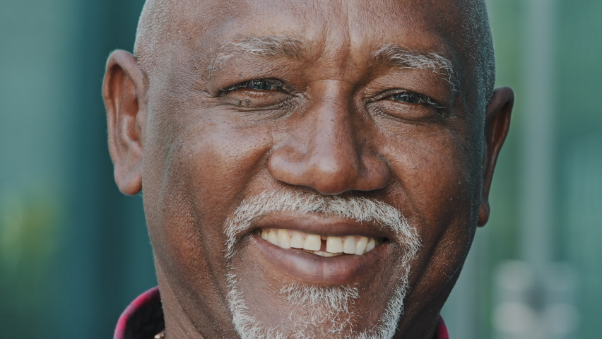 Portrait of happy old 80s African American man looking at camera, smiling, posing outdoors. Head shot of mature senior pensioner, retiree, grandfather, satisfied older customer. Elderly age concept | Shutterstock HD Video #1080533795