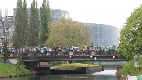 Strasbourg, France - April 30, 2021: One thousand tractors roll for farmer protest in front of European Parliament to put pressure on CAP negotiations underway in Brussels