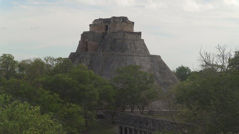 UXMAL, YUCATAN, MEXICO - CIRCA 2021: The Pyramid of the Magician ruins, the central landmark of ancient Mayan city of Uxmal