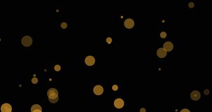 Animation of flying golden dots and colorful balloons. party, festivity and celebration concept digitally generated video.