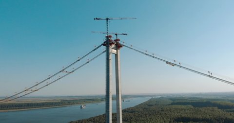 Podul Brăila - suspension bridge in Romania, under construction over the Danube river - aerial drone shot