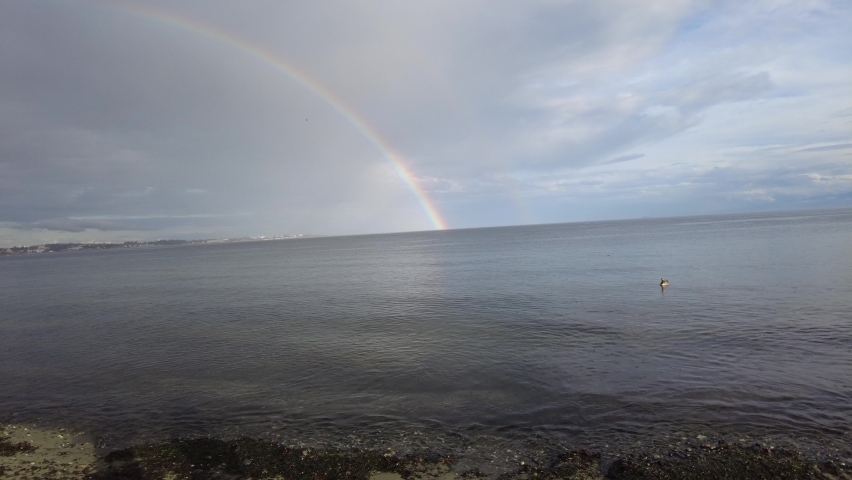 Rainbow over the ocean. Rainbow over the pacific ocean near Victoria on Vancouver Island, British Columbia, Canada.