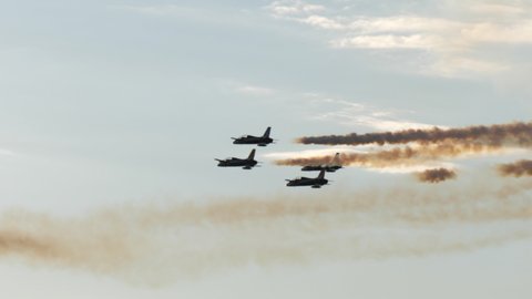 Rivolto Italy SEPTEMBER, 17, 2021 Aermacchi MB-339 A PAN of Frecce Tricolori. Four military jet trainers fly in group in diamond formation crossing other jets leaving contrails in the sky on air show