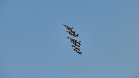 Rivolto Italy SEPTEMBER, 17, 2021 Aermacchi MB-339 PAN of Frecce Tricolori. Tracking view group of nine planes fast fly a diamond formation roll synchronised together on air-show with blue sky