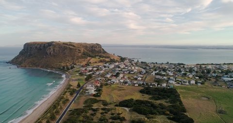 Aerial forward tracking motion view of the township of Stanley and the ancient volcanic plug know as " The Nut", Stanley, Tasmania, Australia