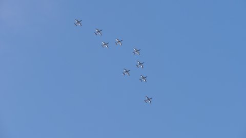 Rivolto Italy SEPTEMBER, 17, 2021 Aermacchi MB-339 of Frecce Tricolori Italian Air Force Aerobatic Team. Zoom out view group of jets perform spread out formation bomb opening with blue sky background 