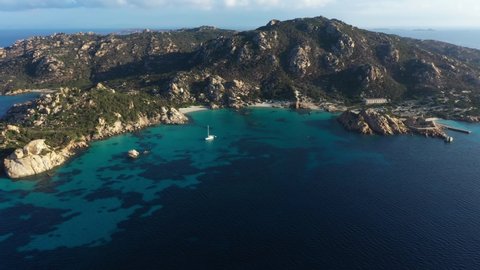 View from above, aerial shot, stunning panoramic view of Spargi Island with Cala Corsara, a white sand beach bathed by a turquoise water. La Maddalena archipelago National Park, Sardinia, Italy.