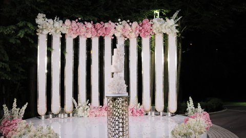 The wedding cake. A beautiful tasty cake at the wedding ceremony. Catering service in event celebratoin wedding party.