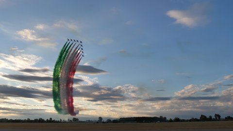 Rivolto Italy SEPTEMBER, 17, 2021 Scenic panorama of jet planes fly over leaving green white red rainbow high in sky. Italian flag contrails smoke concept Alona. Aermacchi MB-339 of Frecce Tricolori. 