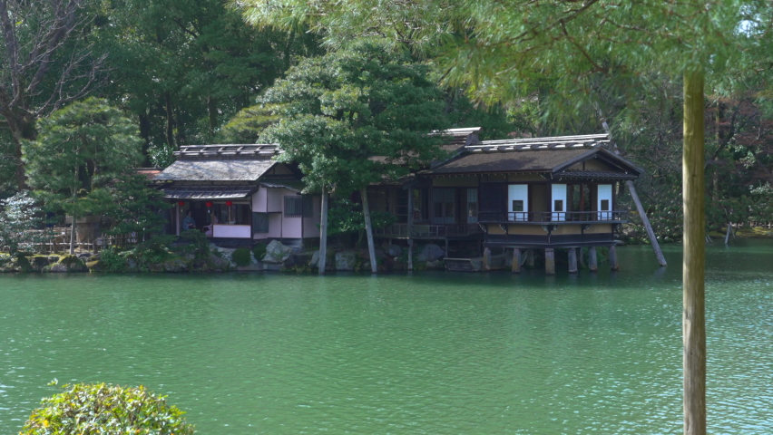 Scenic View Of Traditional Tea House By The Lakeshore At Kenroku-en Garden In Kanazawa, Ishikawa, Japan. Wide Shot