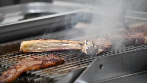 Close up of Beef steak is being cooked on grill. High quality FullHD footage.