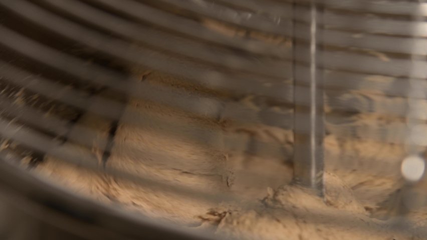 The kneading machine kneads the dough for baking artisan bread. 4k resolution, an Industrial Video by yanik88