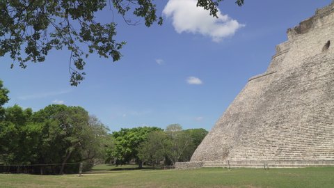 UXMAL, YUCATAN, MEXICO - MAY 2021: Pyramid of Uxmal also known as the Pyramid of the Magician, an ancient Mayan temple and important landmark located in Yucatan peninsula