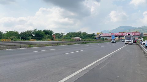 Pune, India - October 10 2021: Traffic on the Mumbai Pune Expressway near Pune India. The Expressway is officially called the Yashvantrao Chavan Expressway.