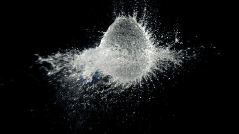 Super slow motion ball bursts with splashes of water. On a black background. Filmed on a high-speed camera at 1000 fps.High quality FullHD footage