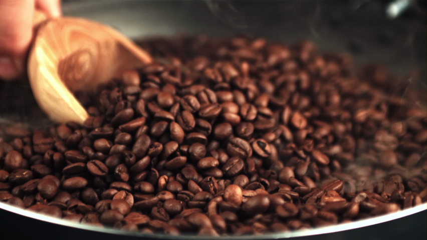 Super slow motion wooden scoop take coffee beans. Filmed on a high-speed camera at 1000 fps.High quality FullHD footage Royalty-Free Stock Footage #1080592322