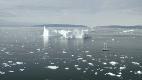 Aerial views of Glaciers and sail boat in Greenland