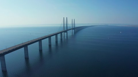 Panoramic aerial view of the Oresundsbron bridge between Denmark and Sweden. Close up view of the Oresund Bridge on a clear sunny day.	