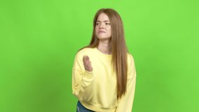 Teenager girl having doubts over isolated background. Green screen chroma key