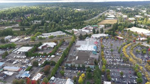 Cinematic 4K aerial drone pan footage of Valley Industrial and downtown, Town Center of Woodinville, an upscale, affluent Seattle neighborhood near Bothell in King County, Washington