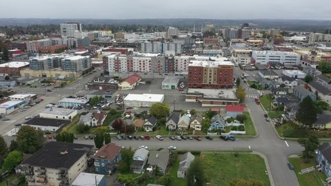 Cinematic 4K aerial drone pan footage of downtown Everett, Bayside, Port Gardner, Naval Station Everett suburbs and bedroom communities North of Seattle on the shores of Puget Sound in Washington