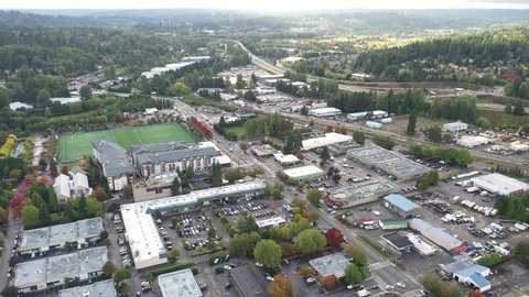 Cinematic 4K aerial drone footage of Valley Industrial and downtown, Town Center of Woodinville, an upscale, affluent Seattle neighborhood near Bothell in King County, Washington